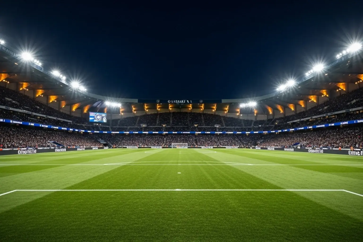 Estadio de fútbol francés iluminado durante un partido de la Ligue 1 con ambiente nocturno